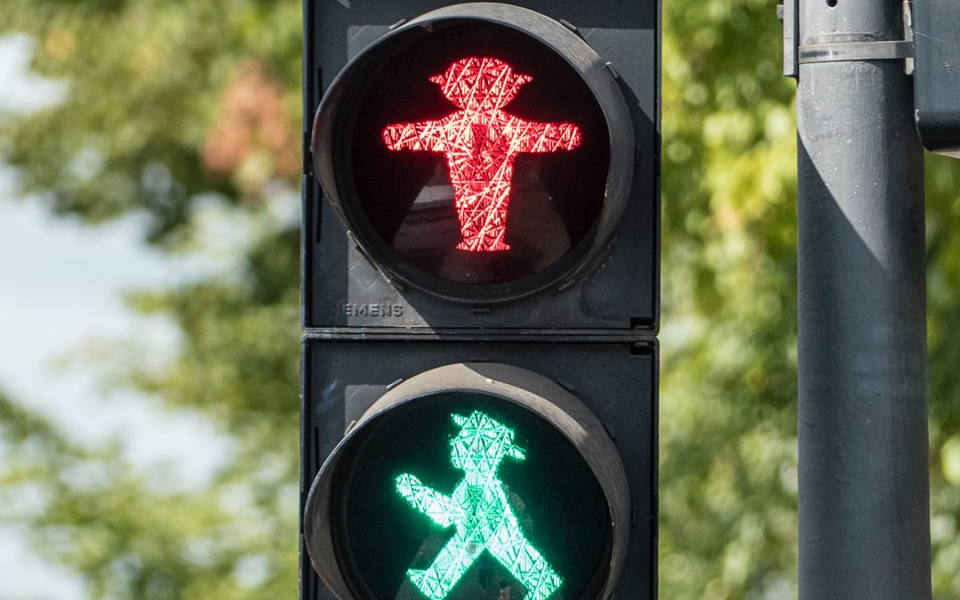 Traffic Lights, Risk Assessment, and Social Distancing in a COVID-19 World