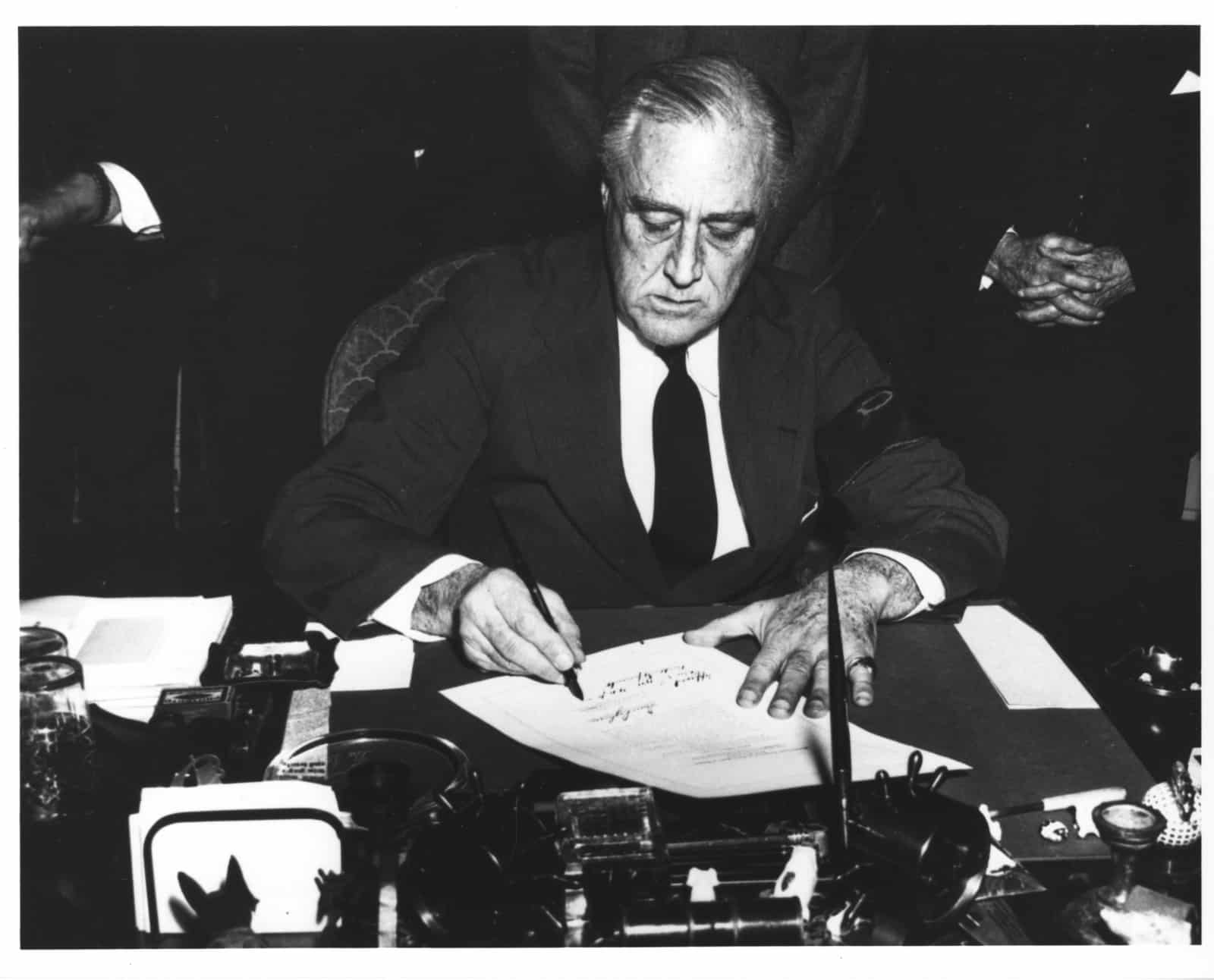 photograph of president franklin d roosevelt signing the declaration of war 3c734e 1600
