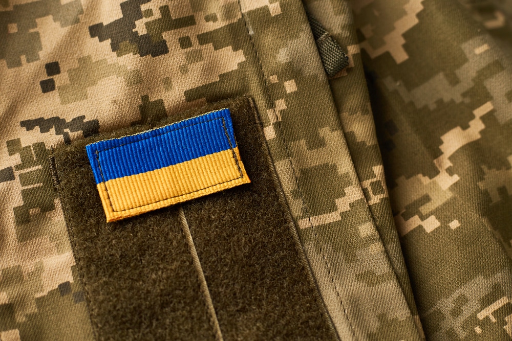 ukraine flag and military uniform of ukrainian soldier. armed forces of ukraine