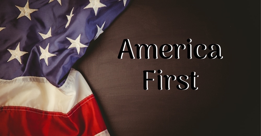 composition of text america first on dark background with american flag. patriotism, independence and celebration concept digitally generated image.