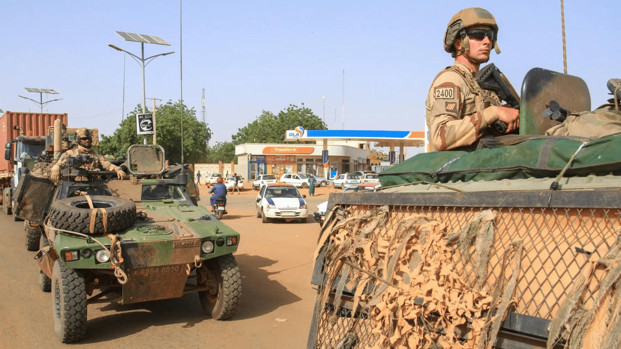 french troops in a convoy leaving niger